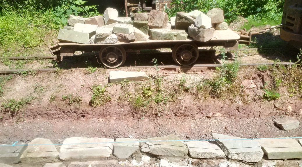 Flat wagon full of stone for the wall