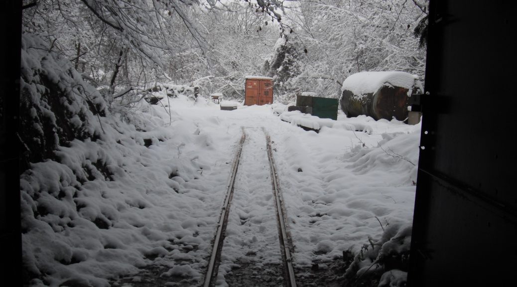 Looking out of the mine into snow