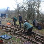 Volunteers undoing fishplate bolts