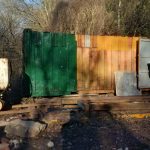 Painting in progress on container